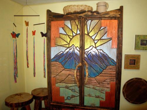 a room with a door with a painting on it at Bright & Sunny Home Near Zion in Hurricane