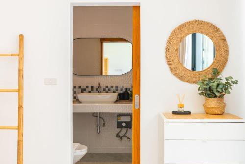 a bathroom with a mirror and a sink at Villa Laura 2Br & Private Pool in Mae Nam in Mae Nam