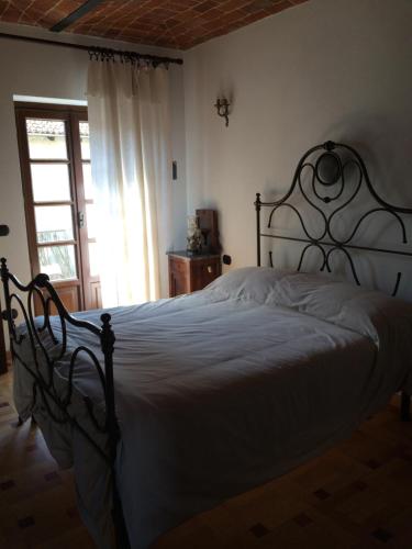 Postel nebo postele na pokoji v ubytování B&B Locanda dai Nonni
