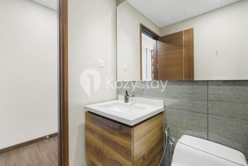 a bathroom with a sink and a toilet at Velir by Kozystay - BSD in Cilenggang