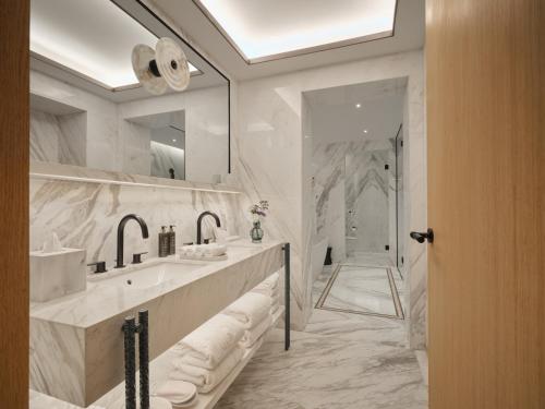 a bathroom with two sinks and a large mirror at The View Rabat in Rabat