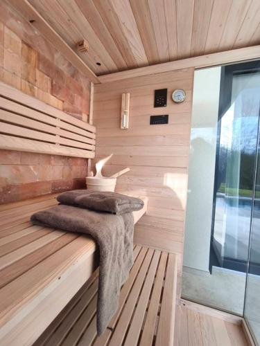 a sauna with two pillows on a wooden bench at Villa Castanea by Villsy in Pazin