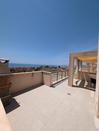 a balcony with a table and a view of the ocean at Hamaca & Sea in Cartagena