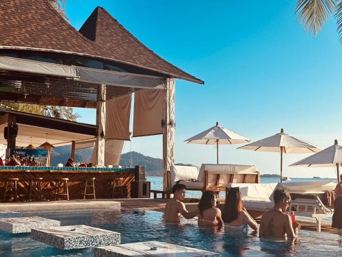 a group of people in the swimming pool at a resort at Exclusive Bungalow Near Swiming Pool At Kohchang Resort in Ko Chang