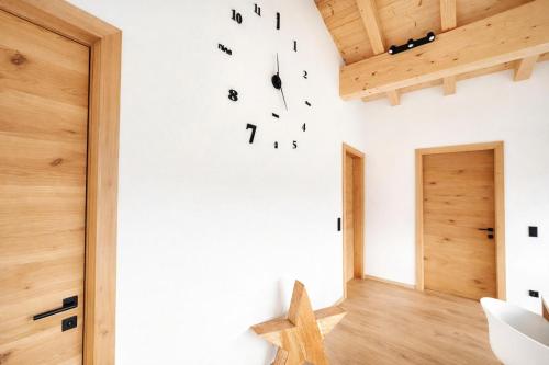 a room with white walls and a wooden ceiling at Mountain Residence in Going am Wilden Kaiser