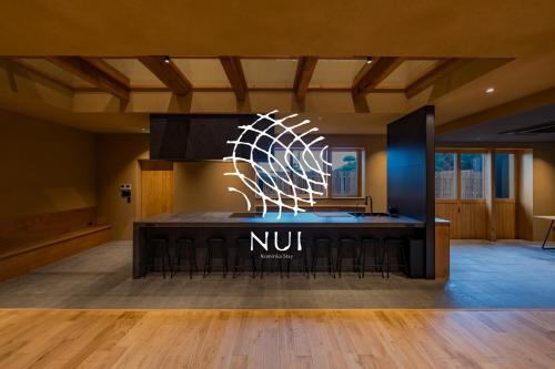 a nunit sign on a table in a room at Nui in Minamiawaji