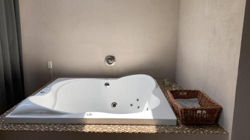 a bath tub sitting on a counter in a bathroom at Gran Despertar El Faro in Santiaguillo