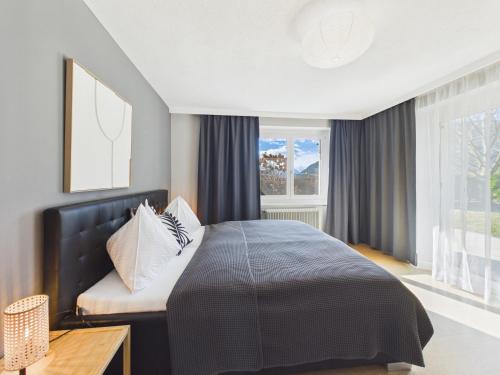 En eller flere senge i et værelse på Boutique73 Suite Garden