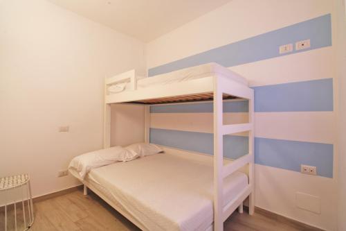 a bedroom with a bunk bed in a room at Dimora Centro Storico in Sirolo