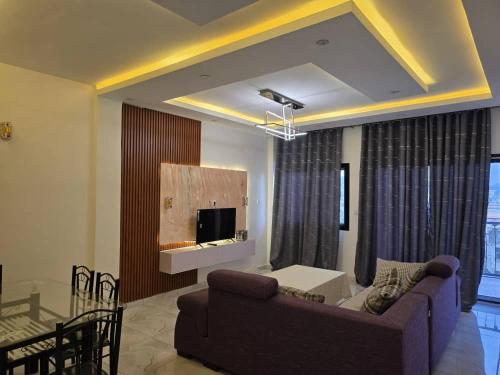 Televizorius ir (arba) pramogų centras apgyvendinimo įstaigoje Cozy'K Home