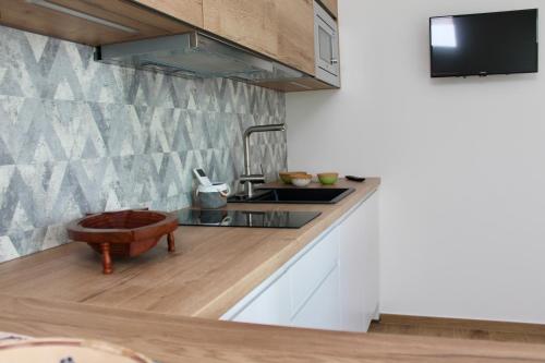 a kitchen with a sink and a tub on a counter at Seaside Apartments - Central Apartments with View - Molfetta in Molfetta