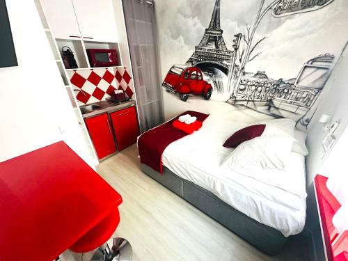 a bedroom with a bed with a mural of the eiffel tower at Beatrice et Emmanuel Meublé Eiffel in Paris