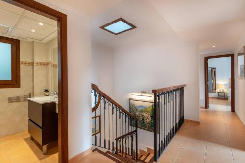 a staircase in a home with a sink and a bathroom at Casa "Valldemossa Paradise" in Valldemossa