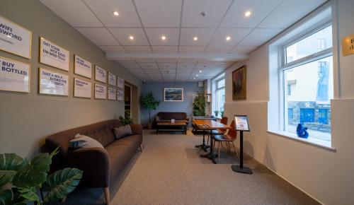 a waiting room with a couch and a table at Old Town Reykjavik in Reykjavík