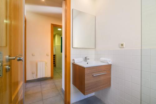 a bathroom with a sink and a mirror at Apartaments Rural Montseny in gualba de Dalt