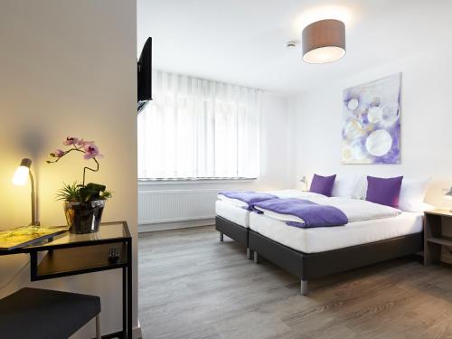 Postel nebo postele na pokoji v ubytování Hotel Hegemann garni