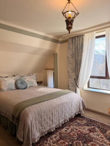 a bedroom with a bed and a large window at Happy House Progled in Progled