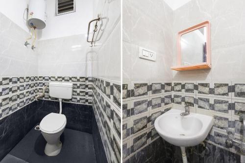 a bathroom with a toilet and a sink at Via Neverland Residency in Pedappai