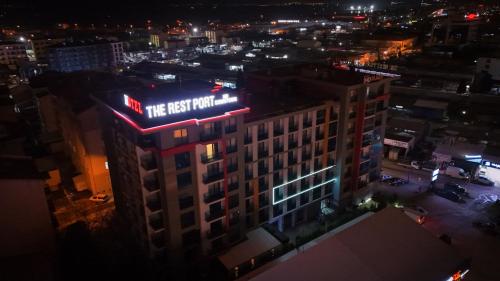a building with a sign on top of it at night at The Rest Port Nd Downtown in Edirne