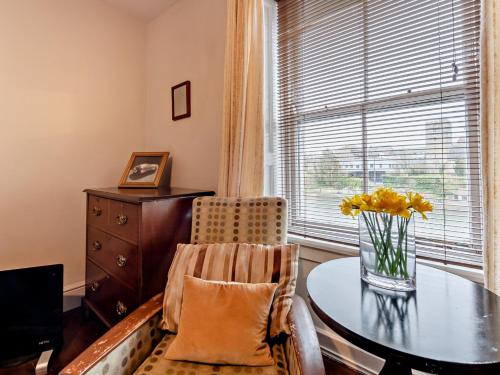 a dining room with a table and a window at Pembroke Lake House in Pembroke