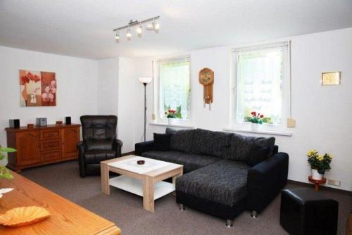 a living room with a couch and a coffee table at Ferienwohnung-Hoffmann-Harzgerode in Harzgerode
