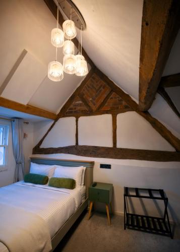 a bedroom with a large bed in a attic at City Rooms by Hiive in Worcester