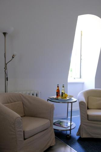 a living room with a couch and a table at Schloss Zinzow in Zinzow