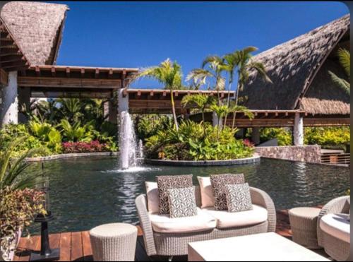 a resort with a fountain in the middle of a pool at Mayan Palace at Vidanta Vallarta in Puerto Vallarta