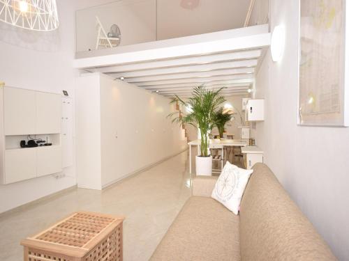 a living room with a couch and a table at Peaceful Algarve Getaway in Olhão