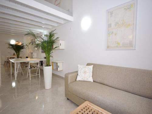 a living room with a couch and a table at Peaceful Algarve Getaway in Olhão