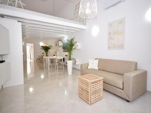 a living room with a couch and a table at Peaceful Algarve Getaway in Olhão