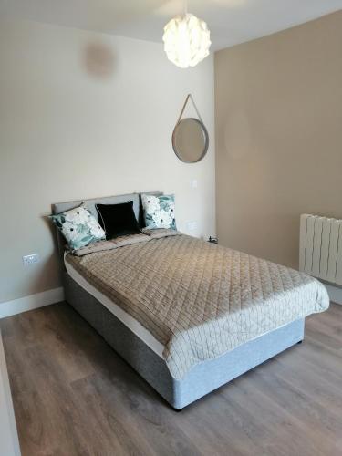a bedroom with a large bed in a room at The Patrick Lofts in Cork