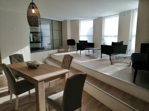 a living room with a table and chairs at The Patrick Lofts in Cork