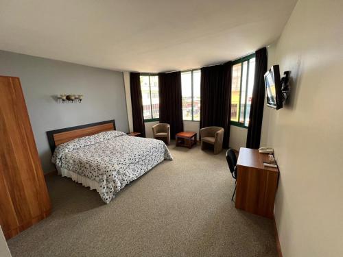 Llit o llits en una habitació de Pro Plus Suites