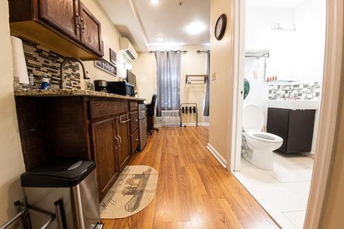a bathroom with a sink and a toilet in it at Shefah Hotel in Union City