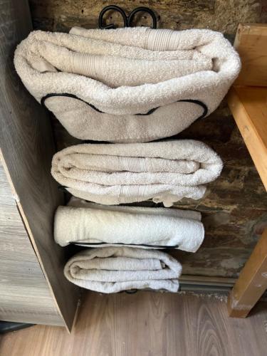 a bunch of towels stacked in a drawer at My cosy space in Spa