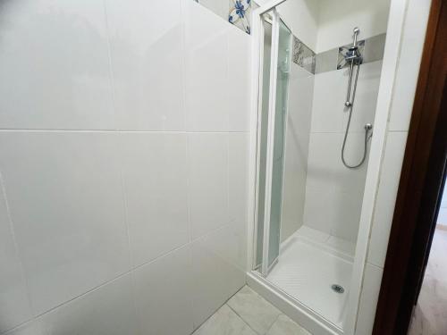 a bathroom with a shower with a glass door at Suite Semeria 466 - Sanremo in Sanremo