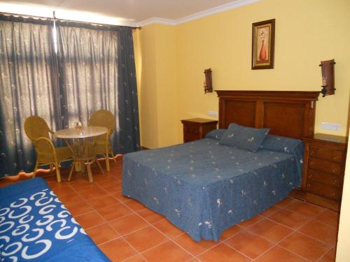 Posteľ alebo postele v izbe v ubytovaní Apartamentos la Atarraya