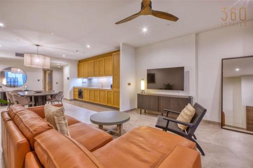 a living room with a couch and a dining room at The Rabat Viewpoint Suites by 360 Estates in Ħal-Bajjada