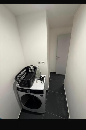 a white room with a stove with a pan on it at Grande rue in Roubaix