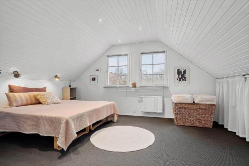 a bedroom with a large bed in a attic at 20427-Samso-Torup-13 in Torup