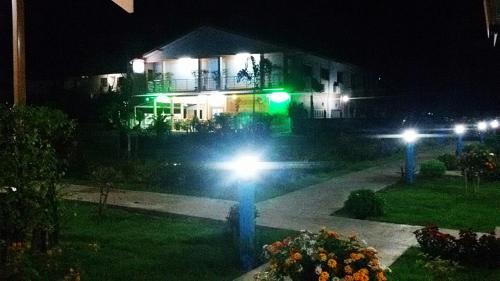 a house with lights in front of it at night at Peace Lanta Mansion in Ko Lanta