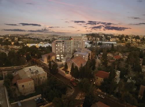 an overhead view of a city at sunset at Orient by Isrotel Exclusive in Jerusalem