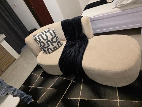 a chair sitting on the floor in a room at Bibo cabins in Ruringʼu