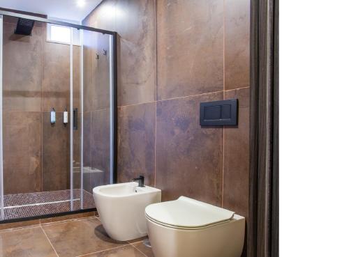 a bathroom with a toilet and a shower at 1029 GuestHouse in Sora