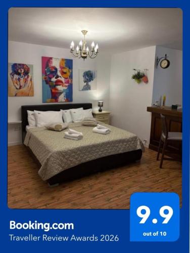 a bedroom with a bed and a chandelier at Marsali Studio in Constanţa