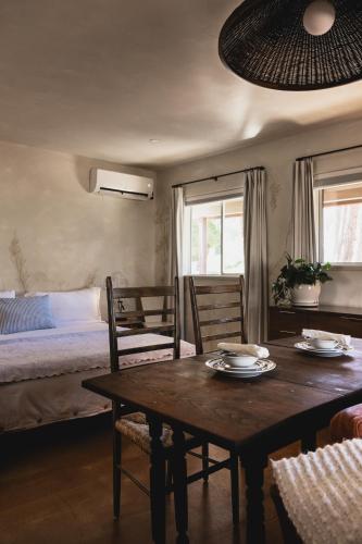 a room with a table and chairs and a bed at Designer King Studio Private Curated Cottage in Cottonwood