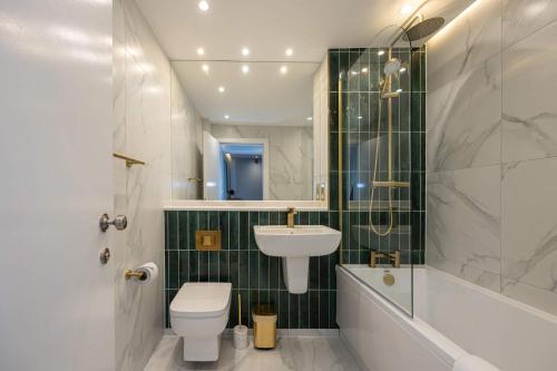 a bathroom with a sink and a toilet and a shower at Host & Stay - Canning Quarters in Liverpool