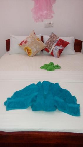 Postel nebo postele na pokoji v ubytování Daban Homestay Ella