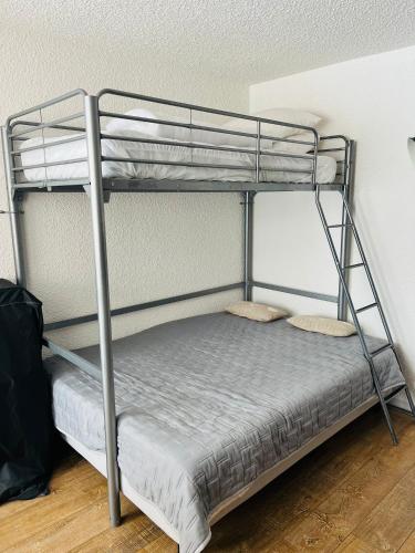 a bunk bed with two pillows on the bottom bunk at LE FONTAGNEL N°310 in Molines-en-Queyras